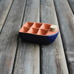 Ceramic seed starter in dark blue