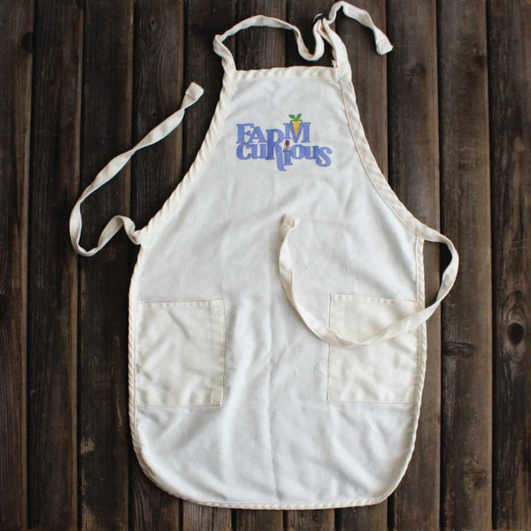 Sturdy cotton apron with FARMcurious logo